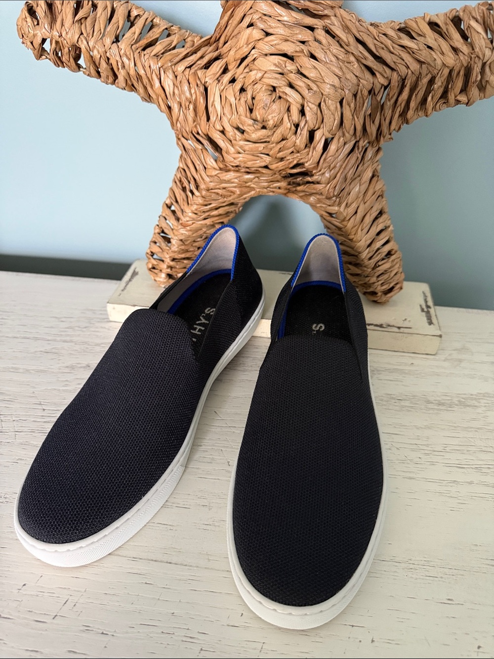 Black Rothy’s knit slip on sneakers